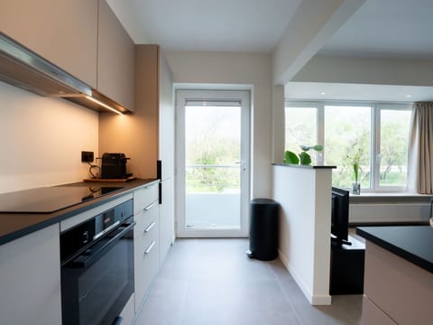 Building, Cabinetry, Window, Plant, Houseplant, Wood, Lighting, Kitchen Stove, Interior Design, Countertop