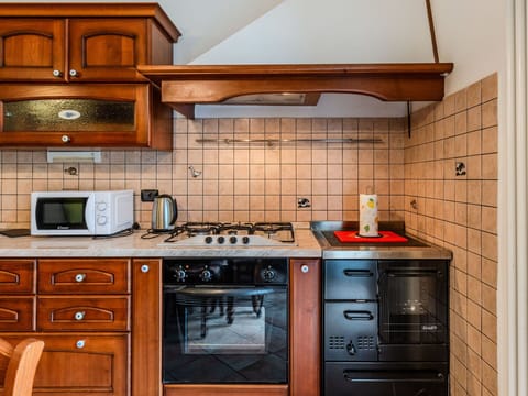 Kitchen, Major Appliance, Kitchen Appliance, Cabinetry, Wood, Kitchen Stove, Countertop, Interior Design, Flooring, Stove