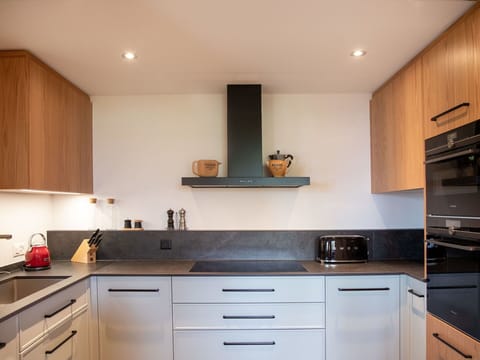 Brown, Cabinetry, Countertop, Property, Furniture, White, Building, Wood, Drawer, Lighting