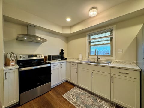 Full kitchen with large stainless sink.