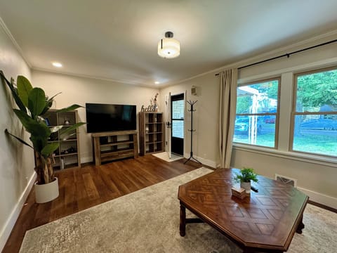 Living room with Smart TV, and plush sectional.