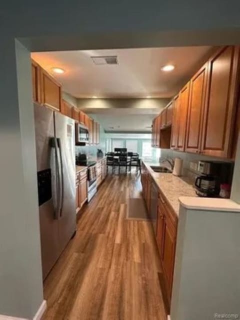 Gourmet Kithen is stocked with lots of small appliances and cookware.