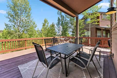 Exterior: Upper deck, outdoor dining, gas BBQ, serene forest views