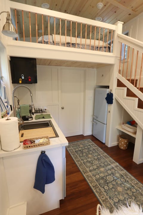 Amenities: tiny fridge, stove, coffee maker, toaster and microwave.