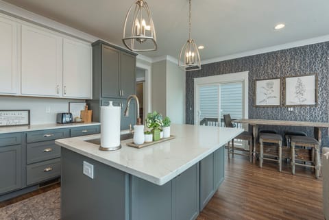 Kitchen with gas range, dishwasher, and two types of coffee makers (standard drip-style and Keurig).