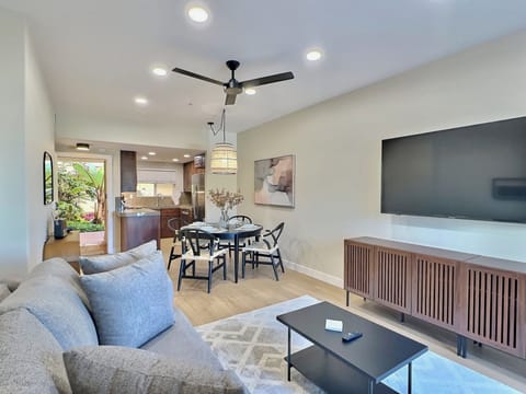 The open living space features a dining area for 4 guests, a comfortable queen sleeper sofa, and a SmartTV for your entertainment.