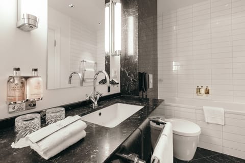 Suite, 1 King Bed | Bathroom | Designer toiletries, hair dryer, bathrobes, slippers