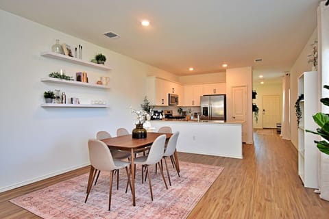Dining room off of the kitchen sits 6