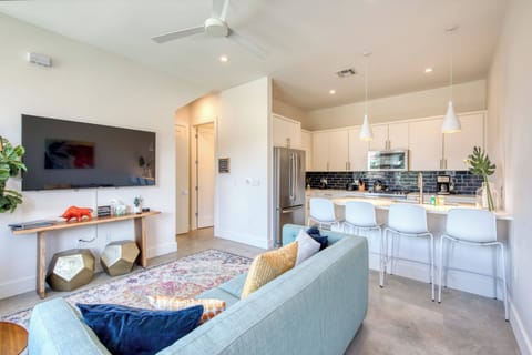 Unit B Living room with sofa sleeper and flat screen TV