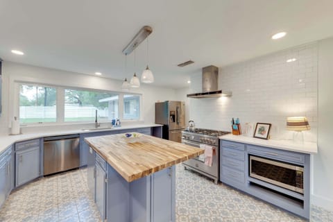 The kitchen is a chef’s dream, offering endless space & top-tier appliances