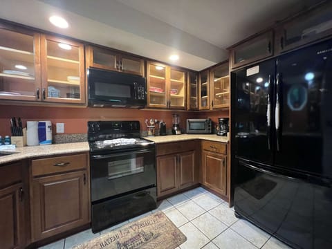 The warm, inviting kitchen offers ample space & every home comfort