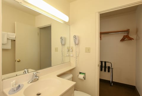 Standard Room, 2 Queen Beds | Bathroom | Combined shower/tub, free toiletries, hair dryer, towels