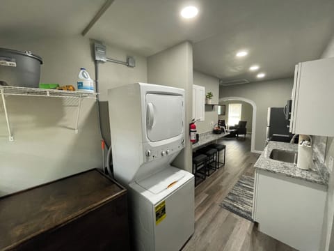 Private utility area with washer and dryer