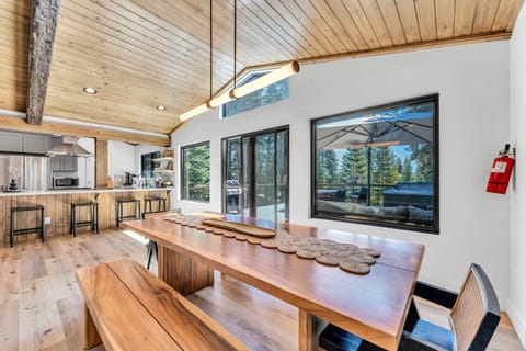 Dining Room: 10-person dining table, adjacent to living room and kitchen