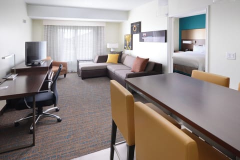 Suite, 1 Bedroom, City View | Desk, laptop workspace, blackout drapes, iron/ironing board