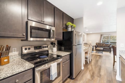 Full kitchen with stainless steel appliances