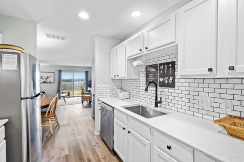 The chic, updated kitchen is spacious & offers all the comforts of home