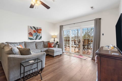 Cozy and spacious living area with TV