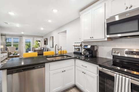 The open, airy kitchen offers ample space & all the comforts of home