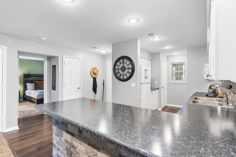 The airy, open kitchen is fully equipped with all the comforts of home