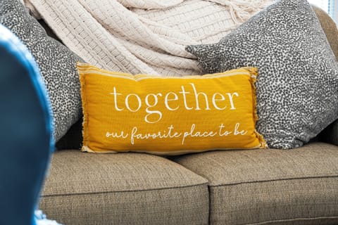 Spacious living room with balcony access TV, and Queen size sofa sleeper