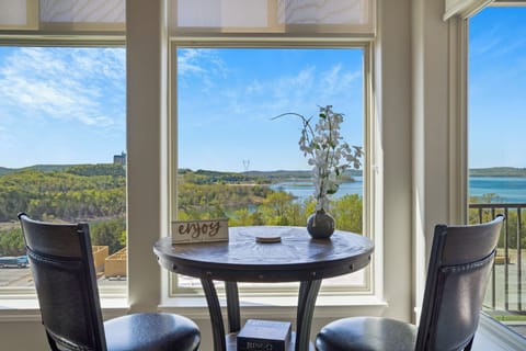 Sunroom with climate control, ample seating, lake view, and Smart TV