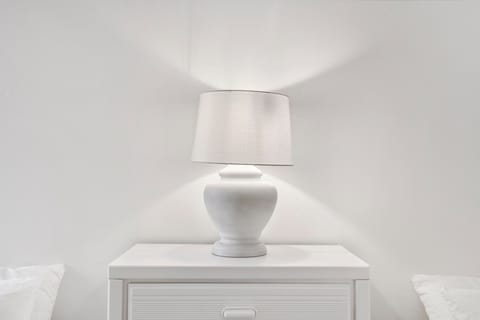 This 1st floor bedroom includes a pair of cozy full-sized beds