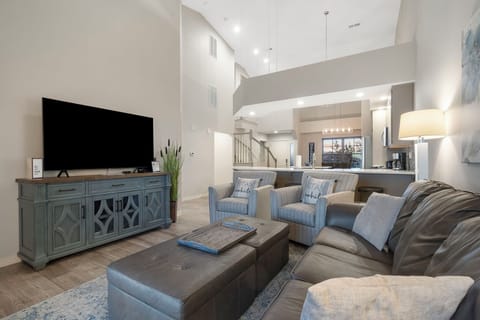 Cozy and spacious living area with TV