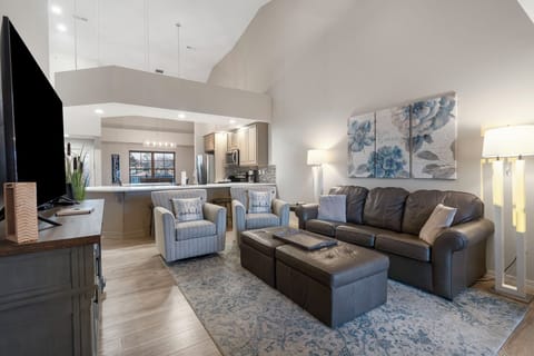 Modern spacious living area with TV