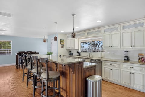 Additional barstool seating at the kitchen island counter.