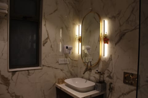 Shower, hair dryer, slippers, towels