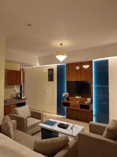 Deluxe Studio Suite, Smoking, City View | Desk, laptop workspace, blackout drapes, iron/ironing board