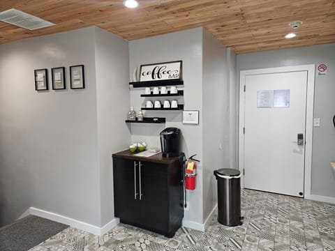 The main bedroom is to your left and the kitchen is to your right when you enter this door.