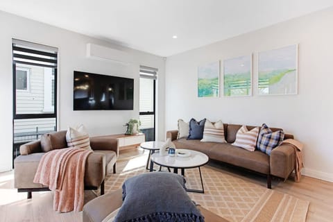 The living room has a neutral colour scheme which invites relaxation.