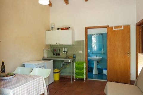 Standard Apartment, 1 Bedroom, Garden View, Garden Area | Private kitchen | Full-size fridge, stovetop, coffee/tea maker, highchair