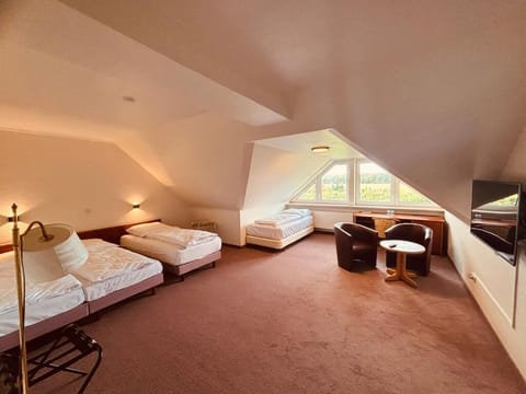 Family Quadruple Room, Garden View | In-room safe, desk, laptop workspace, soundproofing