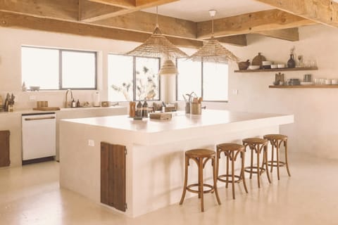 Our custom open kitchen fuses an old-world charm with modern conveniences. The 10' island is great for cooking light meals and gathering with your loved ones.