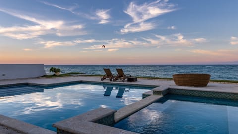 Relax by the oceanfront pool with breathtaking sunset views. Perfect for unwinding after a day of exploring. Enjoy coastal luxury, serene vibes, and the ultimate beachside retreat