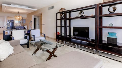 Relax in a bright living room with sweeping ocean views, cool AC, and a Smart TV for the perfect mix of comfort and entertainment.