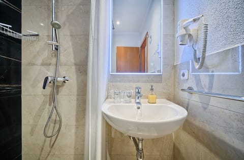 Standard Double Room, Balcony | Bathroom | Shower, hair dryer, towels, soap