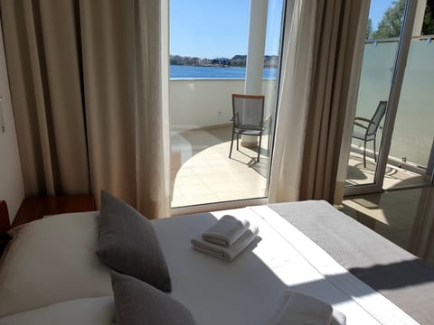 Superior Quadruple Room, 2 Bedrooms, Balcony, Sea View | Blackout drapes, iron/ironing board, cribs/infant beds, free WiFi