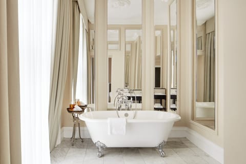 Signature Suite | Bathroom | Rainfall showerhead, designer toiletries, hair dryer, towels