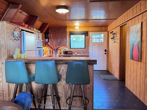 Pull a vintage leather stool up to the counter.