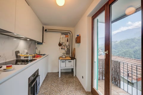 Family Chalet, 2 Bedrooms, 2 Bathrooms, Mountainside (La Canonica) | Private kitchen | Fridge, microwave, oven, stovetop