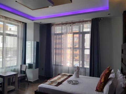 Deluxe Room, Balcony, City View | Desk, laptop workspace, free WiFi