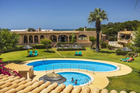 2 outdoor pools, open 8:00 AM to 8:00 PM, pool umbrellas, sun loungers