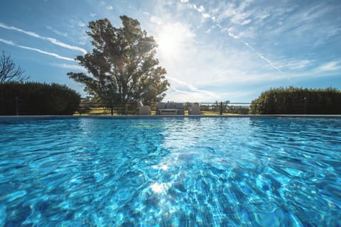 Outdoor pool, open 9:00 AM to 9:00 PM, pool umbrellas, sun loungers