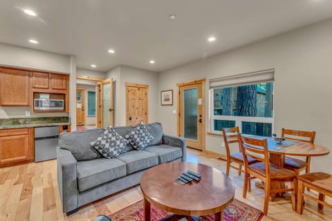 Bonus Room: 2 couches, 42” Smart TV, 4-person dining table, wet bar with microwave, mini fridge and sink, ground floor