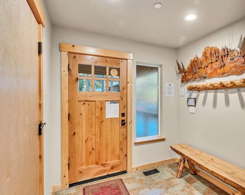 Entryway: Bench, coat hooks, access via attached garage or front door, ground floor