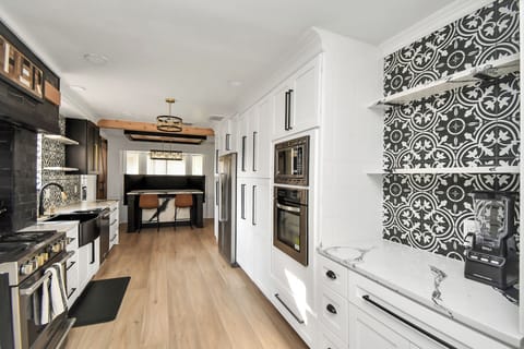 Cook and entertain in style in this spacious kitchen, designed for both functionality and comfort.